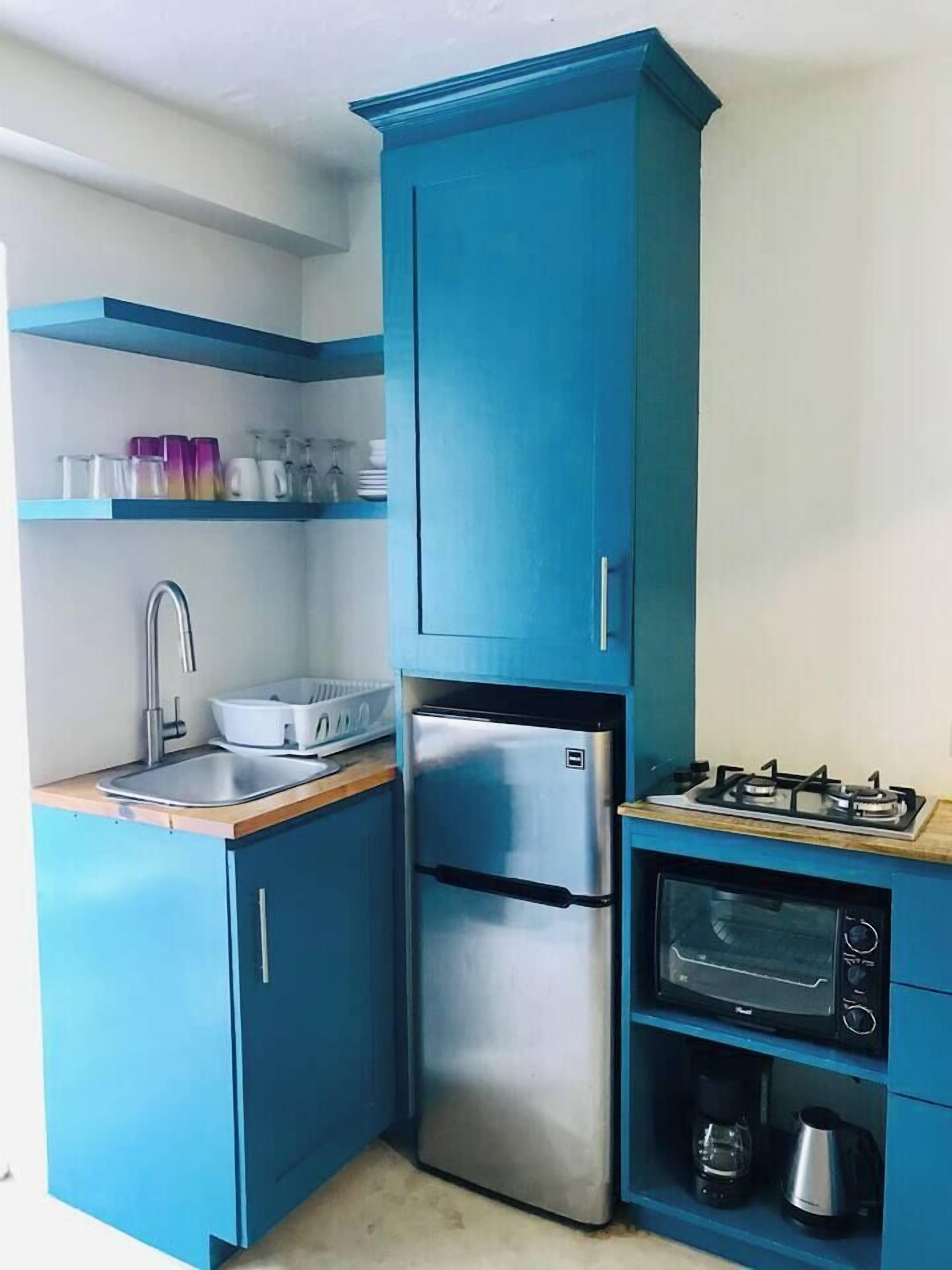 Fridge, microwave, stovetop, coffee/tea maker