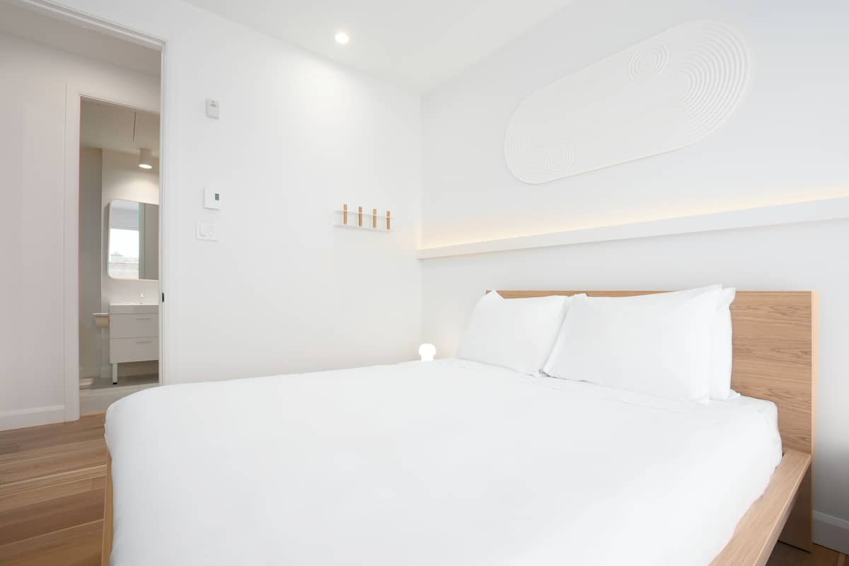 2 bedrooms, blackout curtains, soundproofing, iron/ironing board