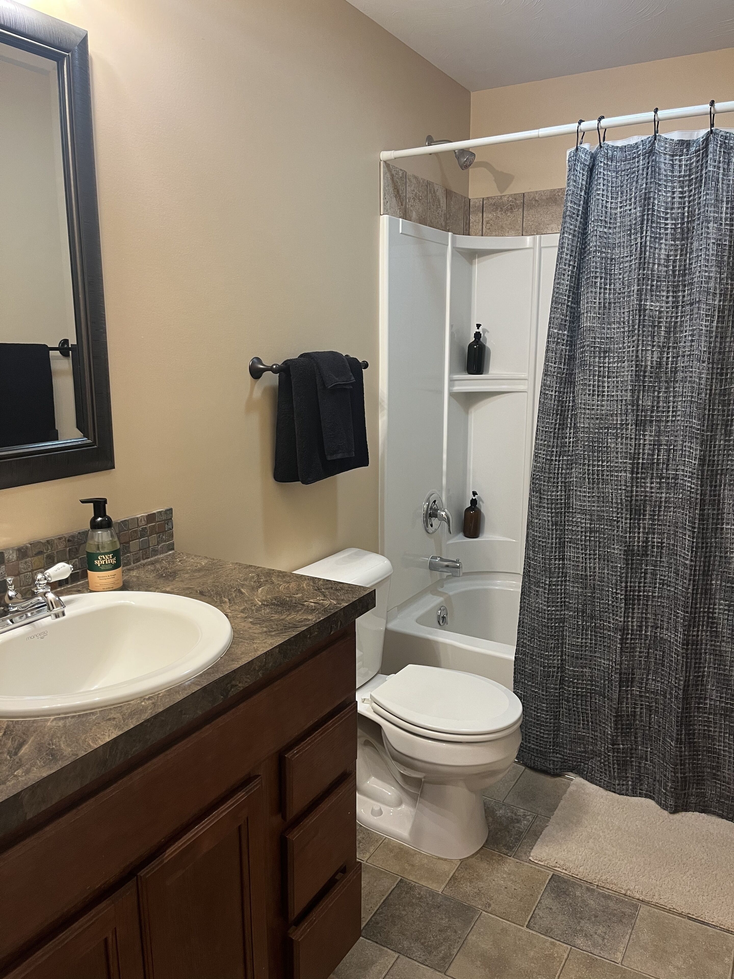 Combined shower/bathtub, hair dryer, towels, soap