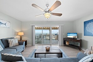 Townhome | Living area | 32-inch flat-screen TV with satellite channels, TV