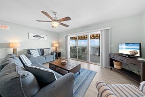 Townhome | Living area | 32-inch flat-screen TV with satellite channels, TV