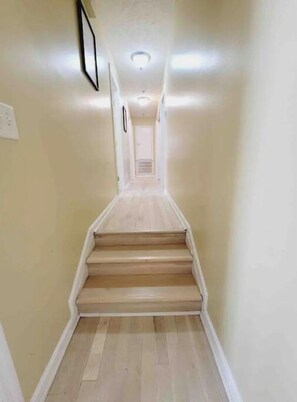 Staircase leads to an upper floor in this elegant hallway.