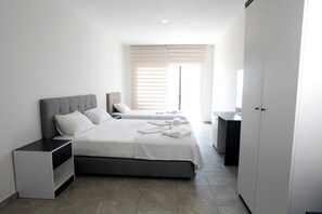Quarto standard | Frigobar, roupa de cama
