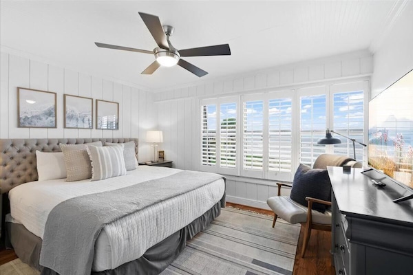 Bright and airy bedroom with scenic window views and cozy decor