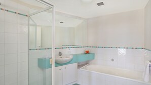A bathroom with a glass shower enclosure, a sink, a bathtub, and a mirror. - PICNIC7- PICTURE PERFECT PICNIC POINT (Maroochydore)