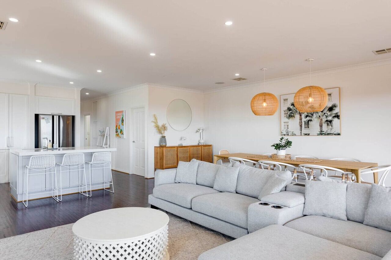 The gray sofa is a stunning centerpiece in this living room, adding a touch of sophistication and elegance to the space.