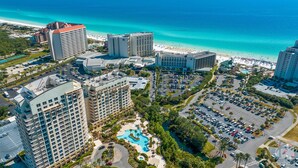 A resort with multiple high-rise buildings, a central swimming pool, and a beach area. - KonaKai-Sandestin® 2BR/2.5BA Views-Walk to Beach! (Miramar Beach)