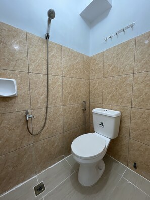 Basic Quadruple Room | Bathroom | Shower, towels - Lawton Residences powered by Cocotel (Taguig)