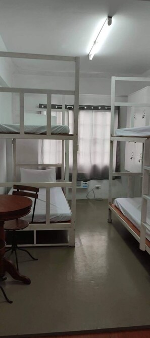 Basic Quadruple Room | Desk, bed sheets - Lawton Residences powered by Cocotel (Taguig)