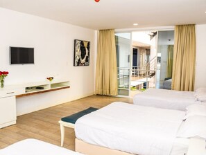 Family Triple Room, 1 Bedroom, Partial Ocean View | Down comforters, Select Comfort beds, in-room safe, desk - Hotel Kinova (Salinas)