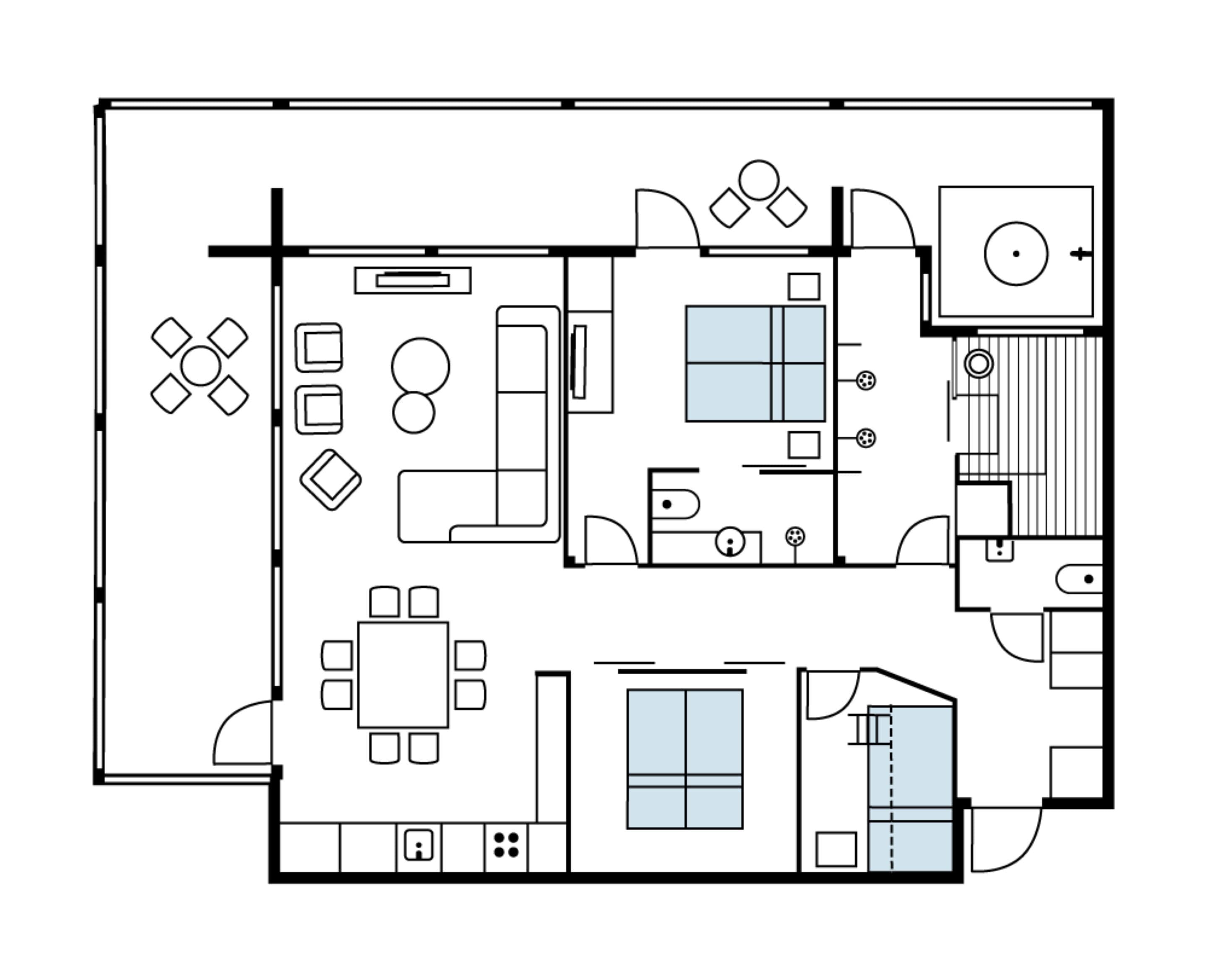 A floor plan with a dining area, kitchen, living room, and a small balcony.