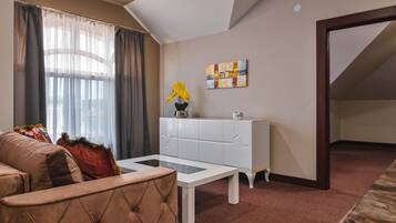 Royal Apartment | Living area | 32-inch Smart TV with cable channels, TV, heated floors