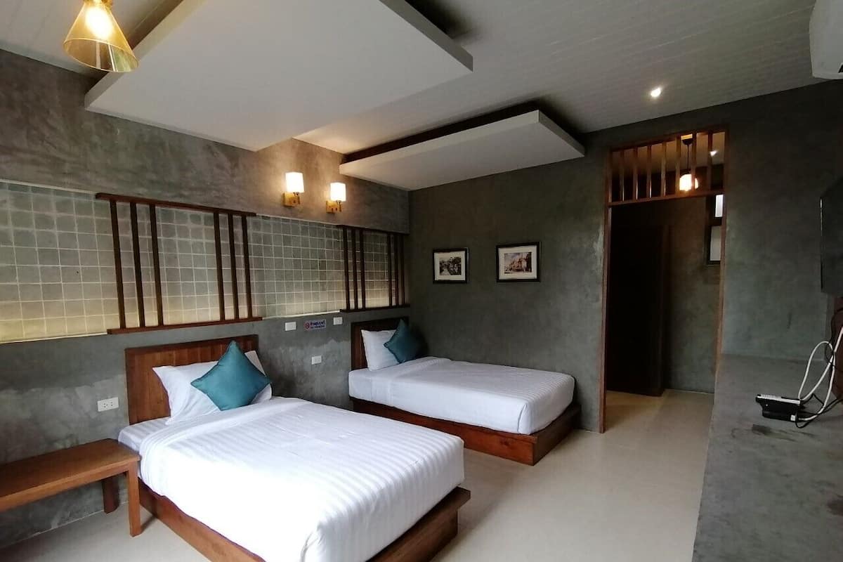 Habitación superior, 2 camas individuales | Decoración individual y espacio para trabajar con un portátil
