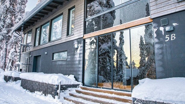 A modern building with large windows and a wooden facade. - Rukan rinnemaa a by Interhome (Kuusamo)
