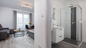 Shower, hair dryer, towels, soap