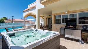 A hot tub, outdoor seating, a barbecue grill, and a pool. - Pet-Friendly Villa Encantada with Sea View & Pool (Arona)