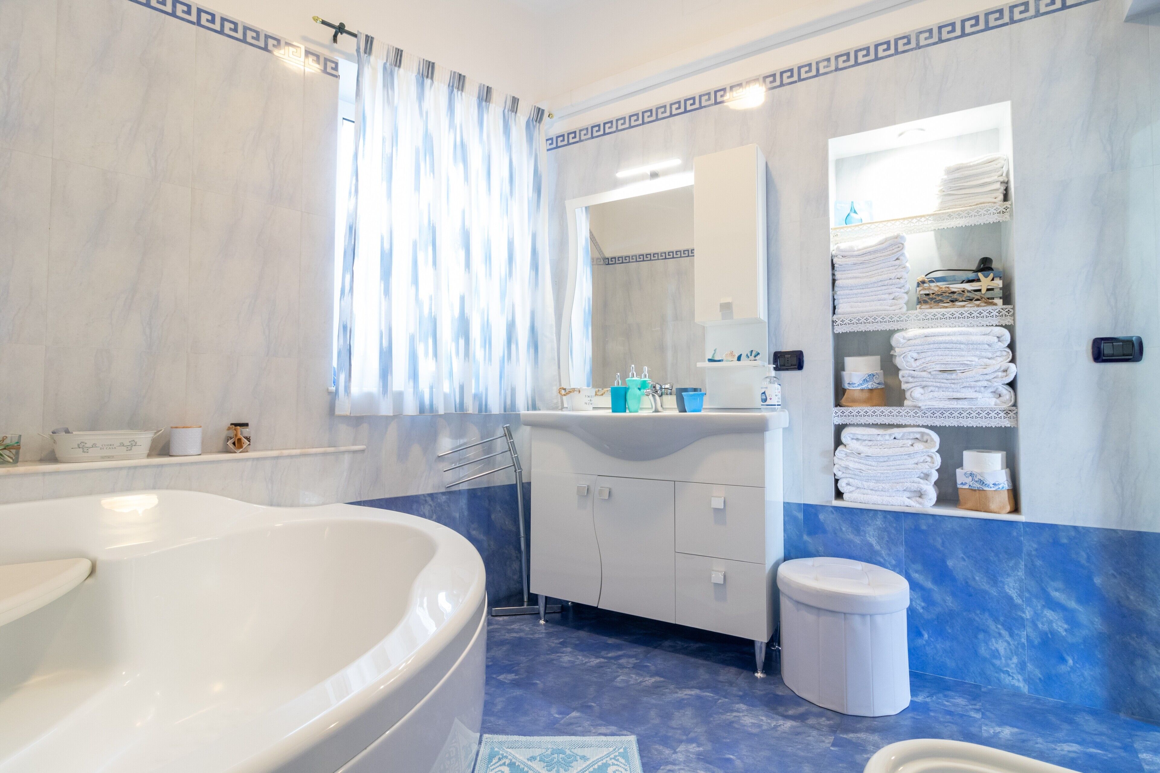 Bathtub, hair dryer, towels