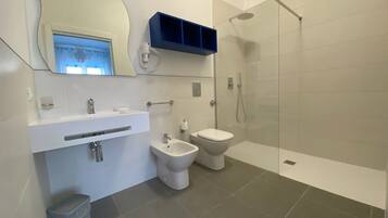 Family Quadruple Room | Bathroom | Shower, rainfall showerhead, eco-friendly toiletries, hair dryer