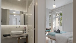 A modern bathroom with a large sink, mirror, and wooden shelf. - Chill Garden Apartment (Funchal)