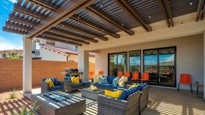 An outdoor patio with wicker furniture, a fire pit, and a pergola. - Arcadia 71 | Private Hot Tub * Fire Pit * Pool Table * Kid's Nook * Views (Santa Clara)