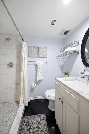 Combined shower/tub, hair dryer, towels, soap
