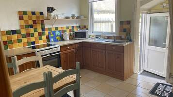 Fridge, electric kettle, toaster, cookware/dishes/utensils