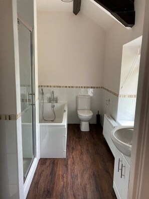 Bathtub, hair dryer, towels, soap