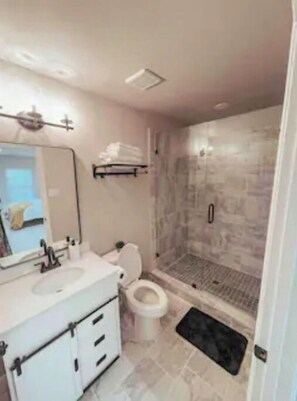Bathtub, towels, soap, shampoo
