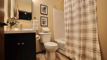 Combined shower/tub, towels, soap, toilet paper