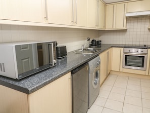 Fridge, electric kettle, cookware/dishes/utensils
