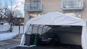 A two-story building with a covered garage. - Le Rameau RC (Montréal)