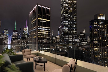 Minibar, in-room safe, desk, laptop workspace at Virgin Hotels New York City