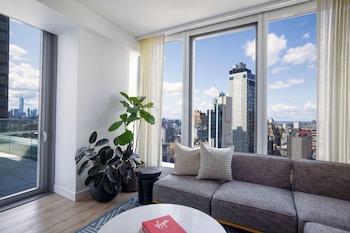 Minibar, in-room safe, desk, laptop workspace at Virgin Hotels New York City