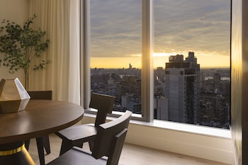 Minibar, in-room safe, desk, laptop workspace at Virgin Hotels New York City