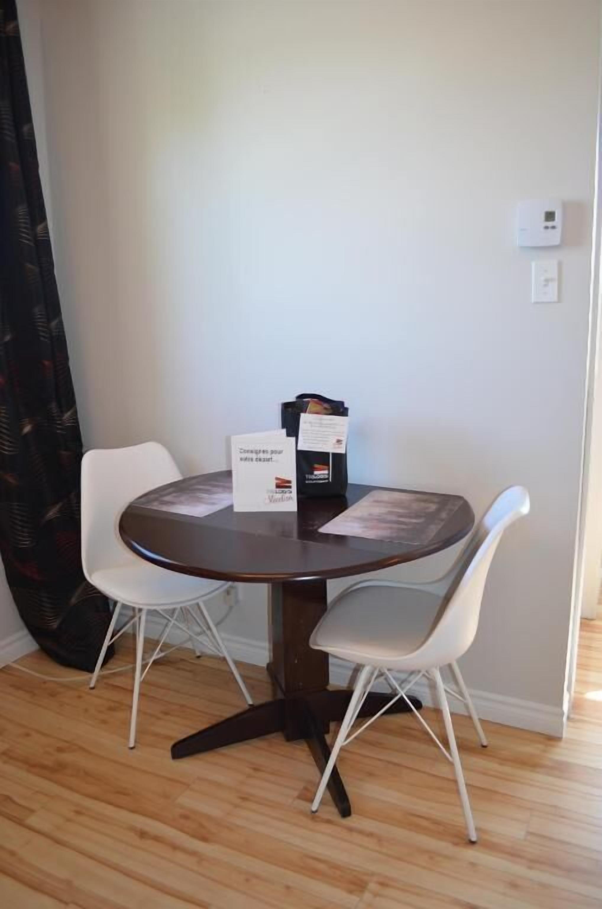 Coffee/tea maker, toaster, cookware/dishes/utensils, dining tables