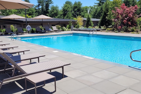 Seasonal outdoor pool, open 8:00 AM to 8:00 PM, pool umbrellas