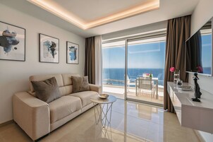 Sea View Apartment-Serenity Suite | Living area | 42-inch Smart TV with digital channels, TV