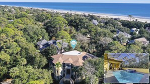 A residential area with a large swimming pool and a view of the beach. - 19 Pelican (Hilton Head Island)