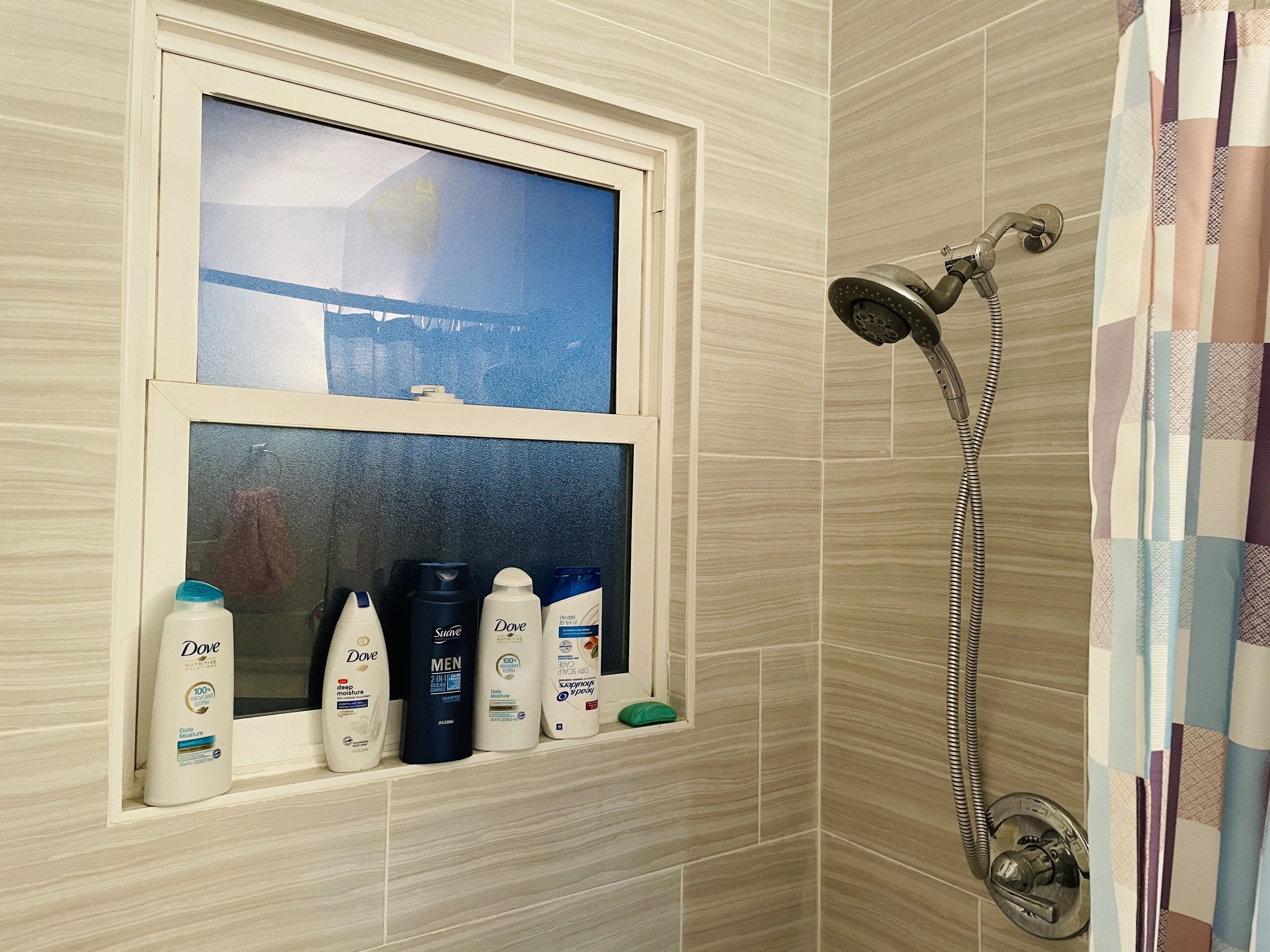 Bathtub, hair dryer, towels, soap