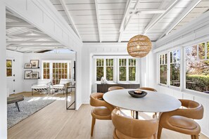 Enjoy meals in a spacious dining area with a round table and six comfortable chairs.