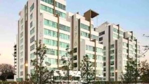 A multi-story hotel with a modern design, featuring a central atrium and balconies on each floor. - 2 BEDROOMS WITH POOL, GYM, 24 HOURS SECURITY, 7 PEOPLE (Guadalajara)