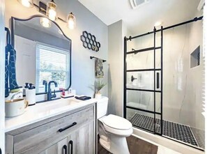 Shower, hair dryer, towels, soap