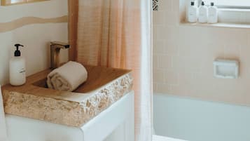 Combined shower/bathtub, hair dryer, towels, soap