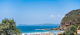 Amazing beach views with a pool. Easy walk to beach and bay