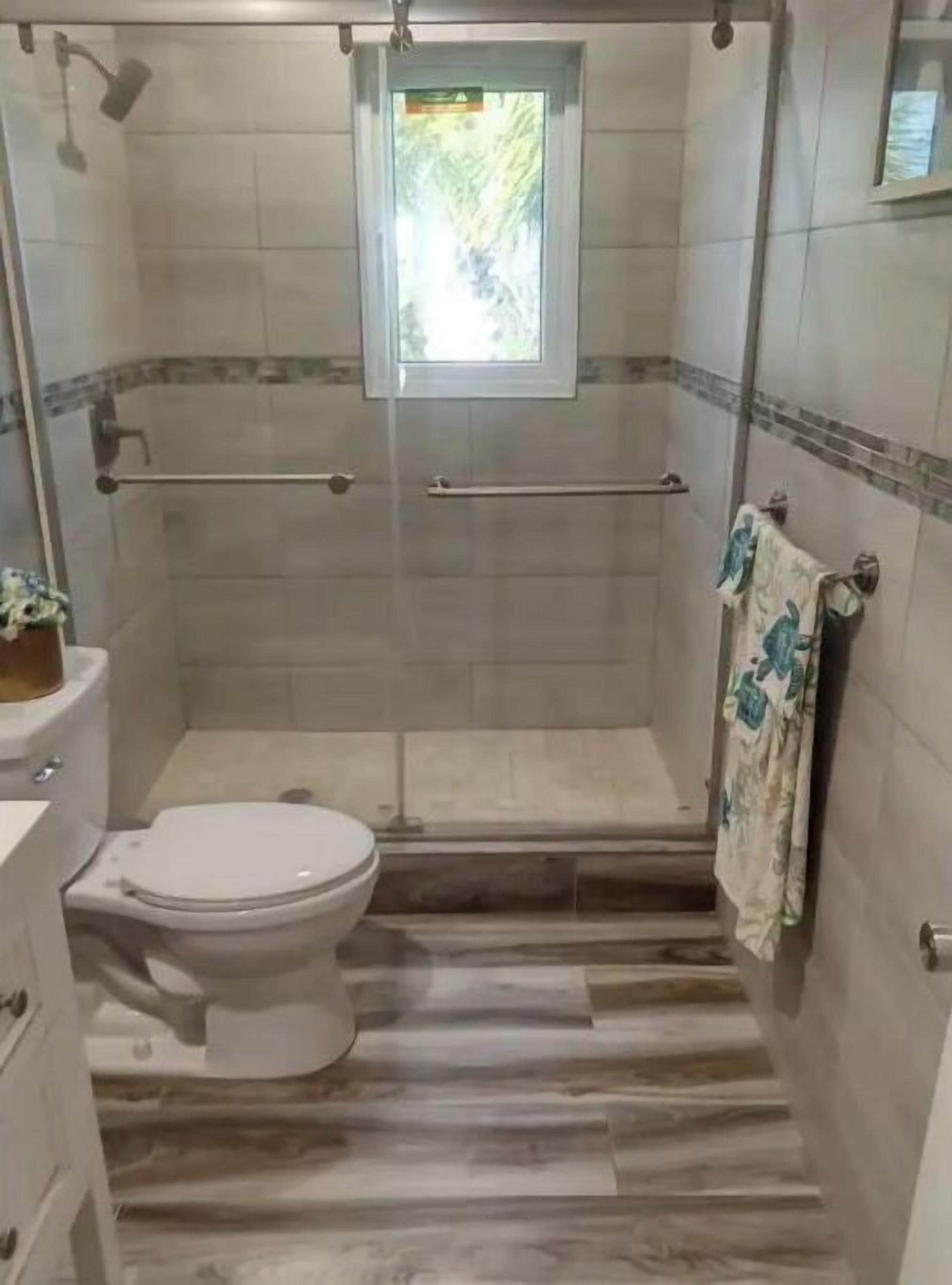 Shower, hair dryer, towels, soap