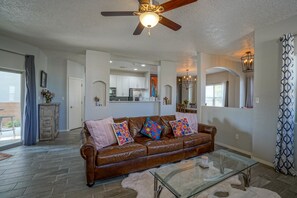 Smart TV, fireplace, books, computer monitors