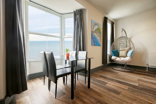 Large seafront apartment with balcony, parking and sea views