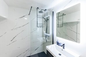 Shower, hair dryer, towels, soap