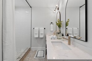 Combined shower/tub, hair dryer, towels, soap