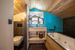 Bathtub, hair dryer, towels